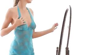 A girl is making erotic poses in front of the mirror