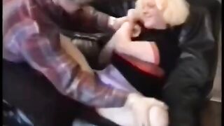 A cute babe is having fun with a motorcyclist