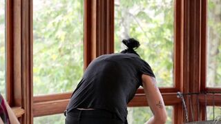 Vietnamese with a strap-on fucks a virgin in the kitchen, a steamy scene from StrapOn, known for its adventurous and sensual content featuring couples and lesbian sex enhanced by the use of strap-on dildos