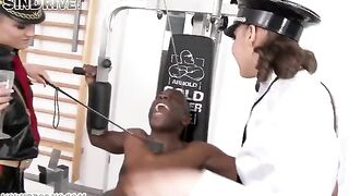 A black-skinned man has sex with two girls covered in latex