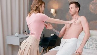 Lovers have a conversation while lying on the bed completely naked