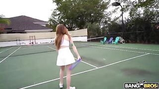 The girl is having fun with a tennis coach on the court