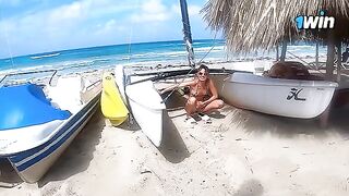 A couple enjoys passionate and rough sex on the naked beach