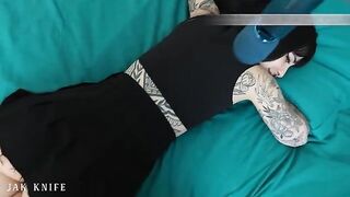 A girl with a vibrator advertises her stuff on the bed she shares with her friend