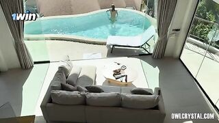 A beautiful girl has a smoking session by the pool