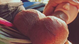A girl with a silicone mouth works outdoors and seduces men