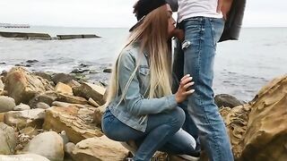 A blondie is having fun with her boyfriend on the city beach