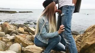 A blondie is having fun with her boyfriend on the city beach